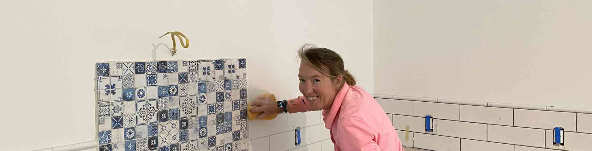 The Sunnyside Sisters Bed and Breakfast / Clarksville VA / Grouting kitchen backsplash, M finished the job  though