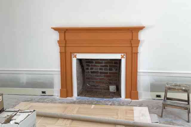 The Sunnyside Sisters Bed and Breakfast / Clarksville VA / Fireplace mantel Orange with Fleur-de-Lis