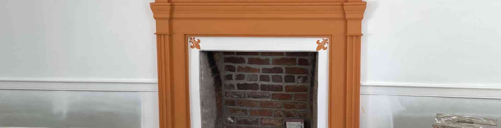 The Sunnyside Sisters Bed and Breakfast / Clarksville VA / Fireplace mantel Orange with Fleur-de-Lis