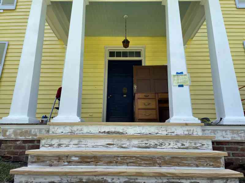 Last Saturday our dear friend Patty painted the ceiling of the front porch of the Sunnyside haint blue* and the front door dark blue. We are very happy with the…