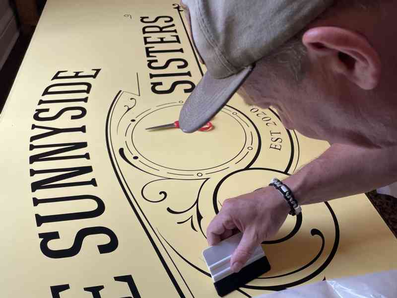 Yesterday we took the time to put on the text for the sign. It's a precision job, but we think it looks great. 
Next we have to put on the logo and the outlines…