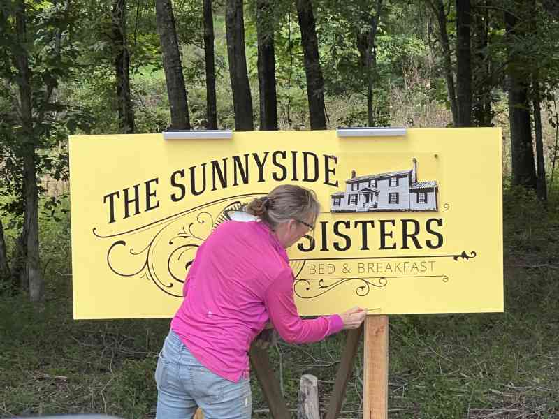 Things go a bit slower when its 95 degrees outside. But after some wait/delay on the last piece of the the Sunnyside Sisters sign, it is finally done!To top it…