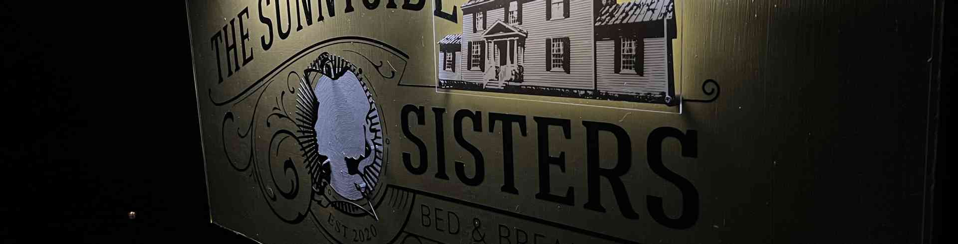 The Sunnyside Sisters Bed and Breakfast / Clarksville VA / Sunnyside Sisters B&B sign from right side, at night