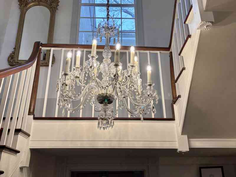 Yesterday, we proudly hung our magnificent antique chandelier in the lobby.Over five years ago, we had the chandelier carefully packed and stored for shipping…